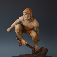 DUDE! ;  Bronze sculpture, edition of 25;19"H x 13"W x 13"D;Image of a male skateboarder, caught up in the thrill of riding the half pipe on the rear wheels, oblivious to the risk and feeling the exhileration of defying physics and reveling in his sense of mastery.